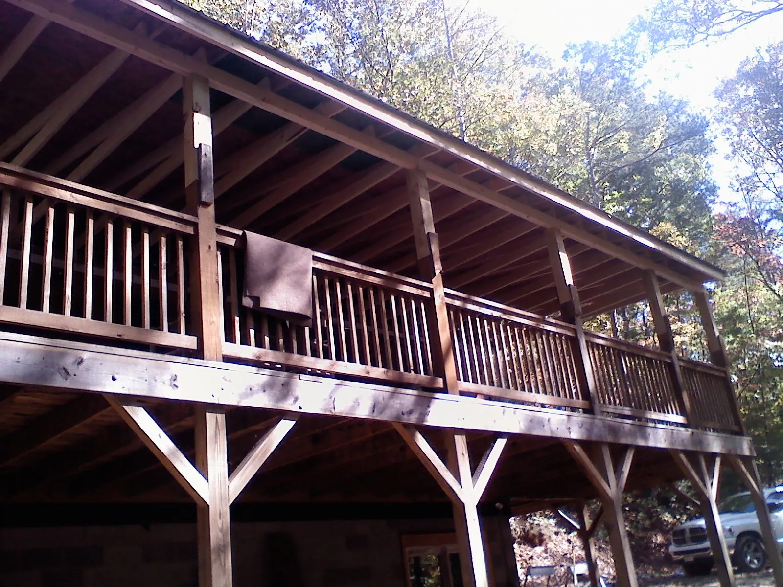 Timber framing under a new elevated porch and deck — Roof Leak Repair in New Boston by Roofing Brothers